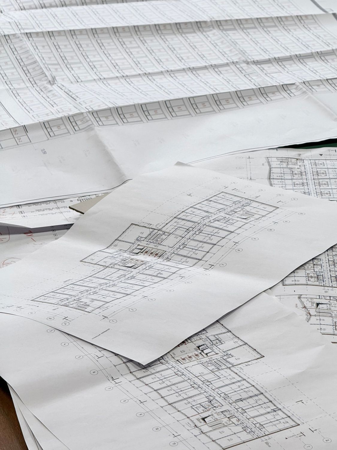 Architectural drawings spread across a table